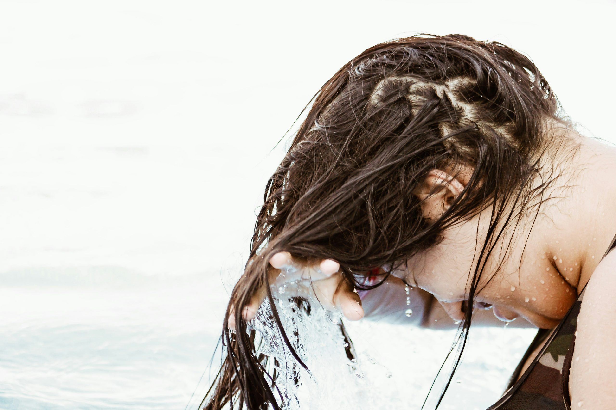 woman washing hair outside